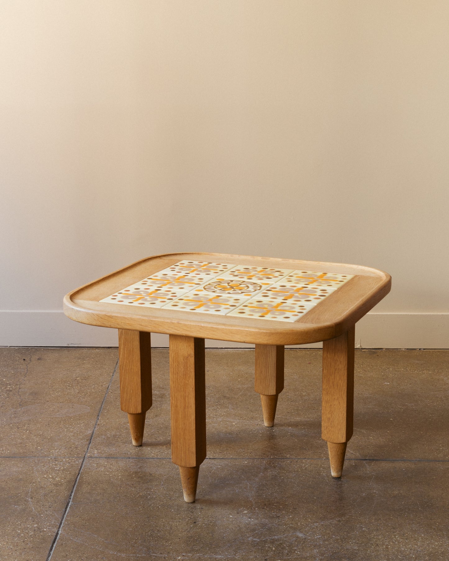 Image of Guillerme and Chambron oak side table with nine-tile ceramic top, France 1960s.