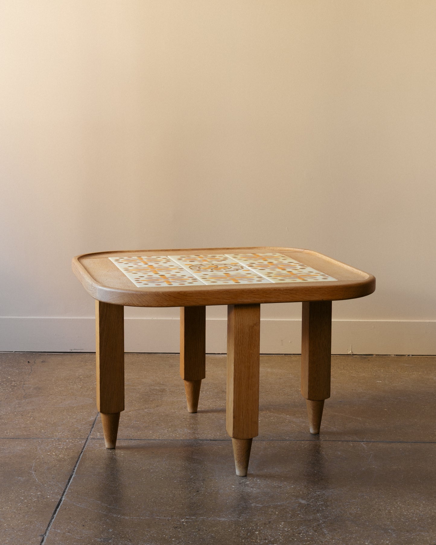 Image of Guillerme and Chambron oak side table with nine-tile ceramic top, France 1960s.