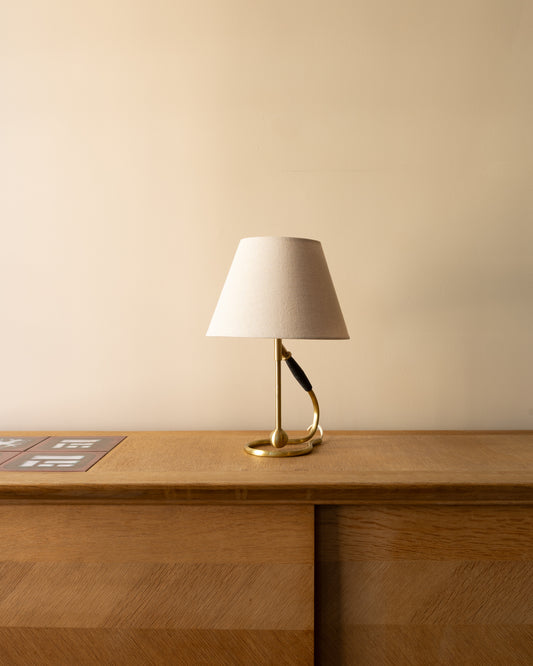 Danish brass Model 306 lamps by Kaare Klint for Le Klint, 1950s. Convertible wall or table design in lacquered brass with bakelite fittings